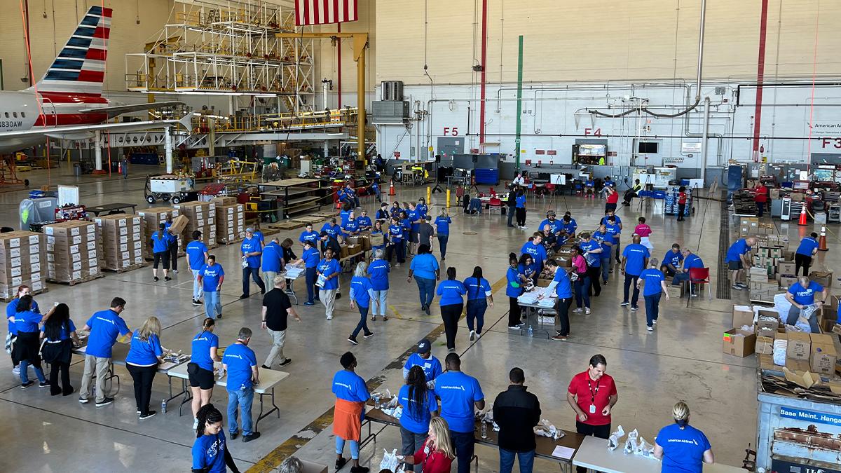 Volunteers helping to pack boxes 