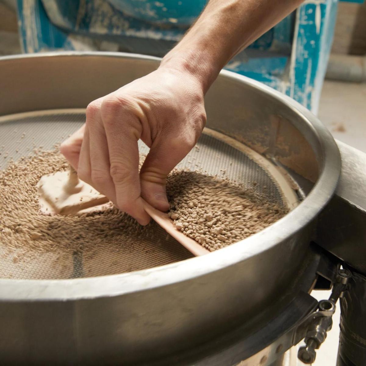 A person repurposing pottery