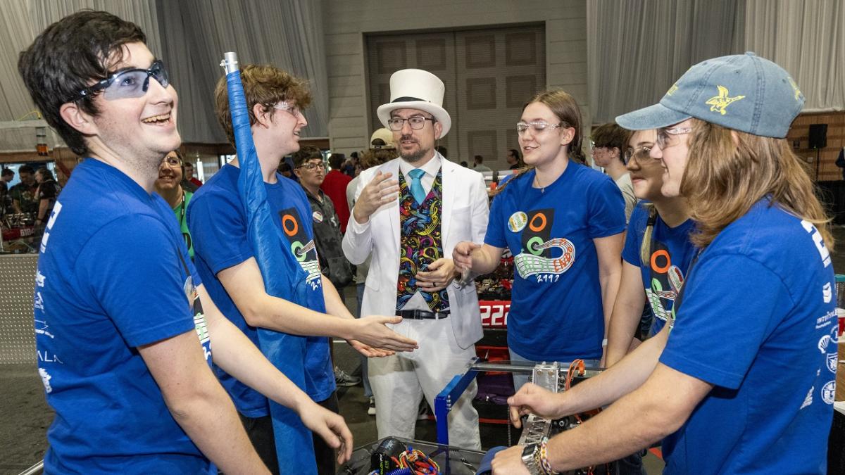 People in blue t-shirts standing together