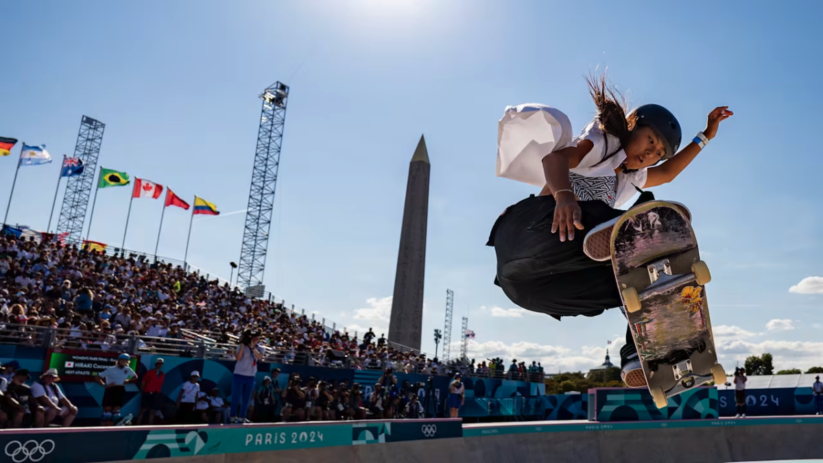 An Olympic skateboarder with a crowd behind them