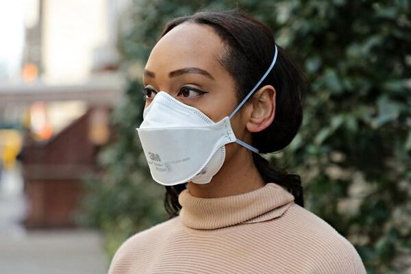 Young woman wearing a 3M N95 mask.