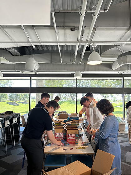 People packing boxes on a table