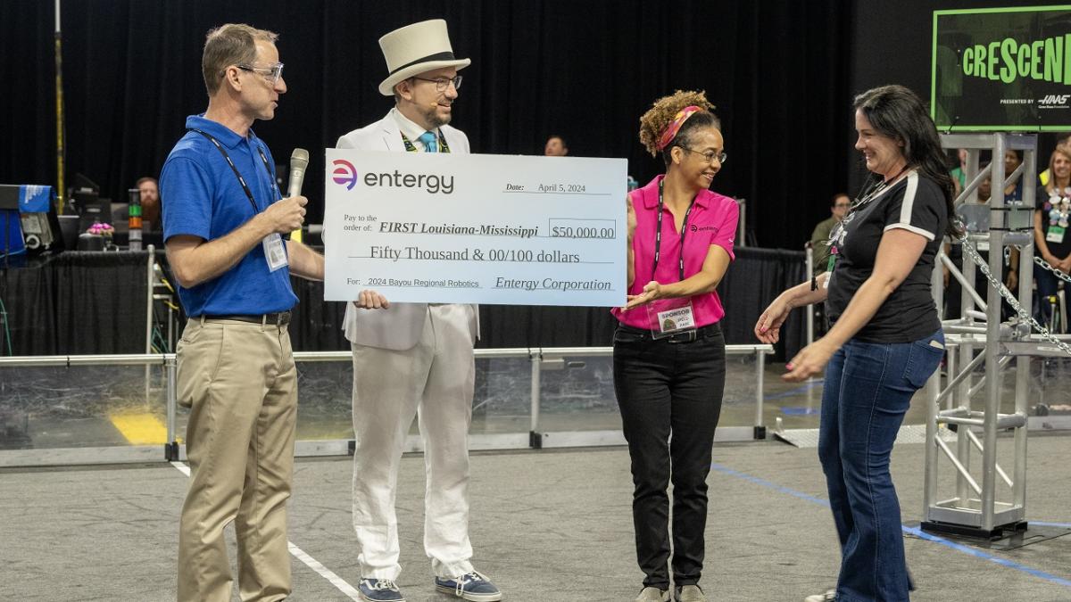 People holding a large check