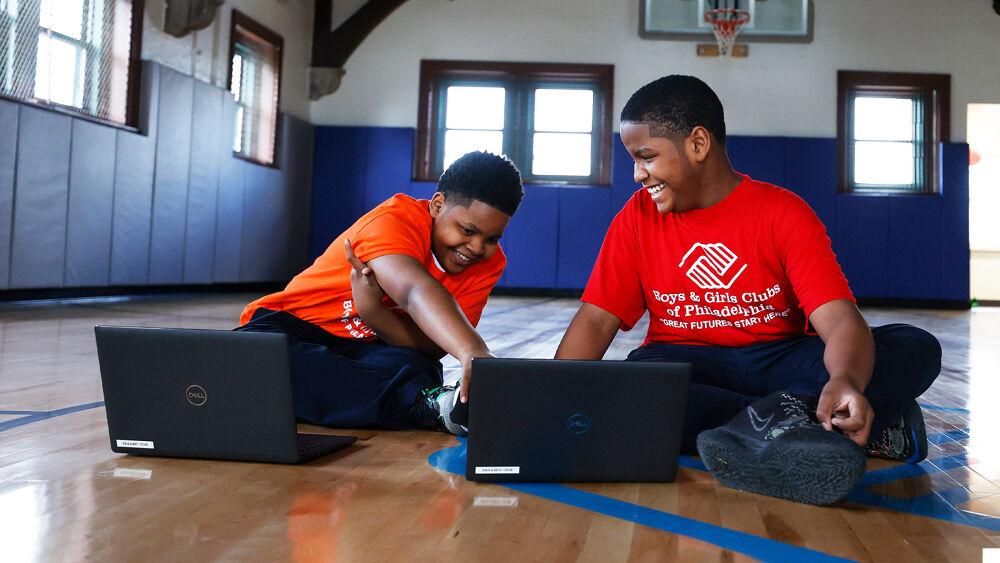 children sitting with computers