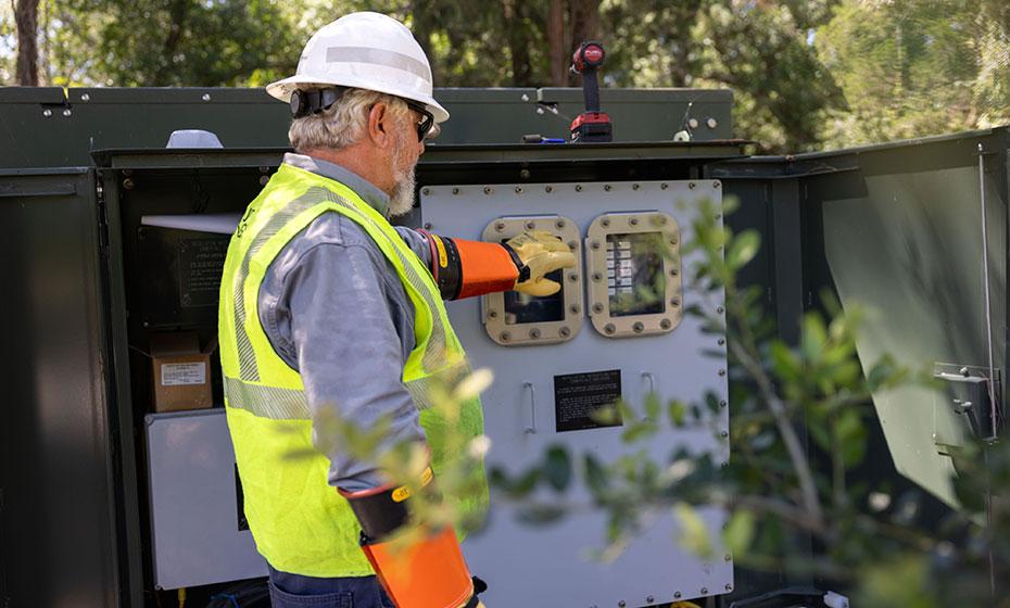 Worker in a hard hat and reflective vest working outside