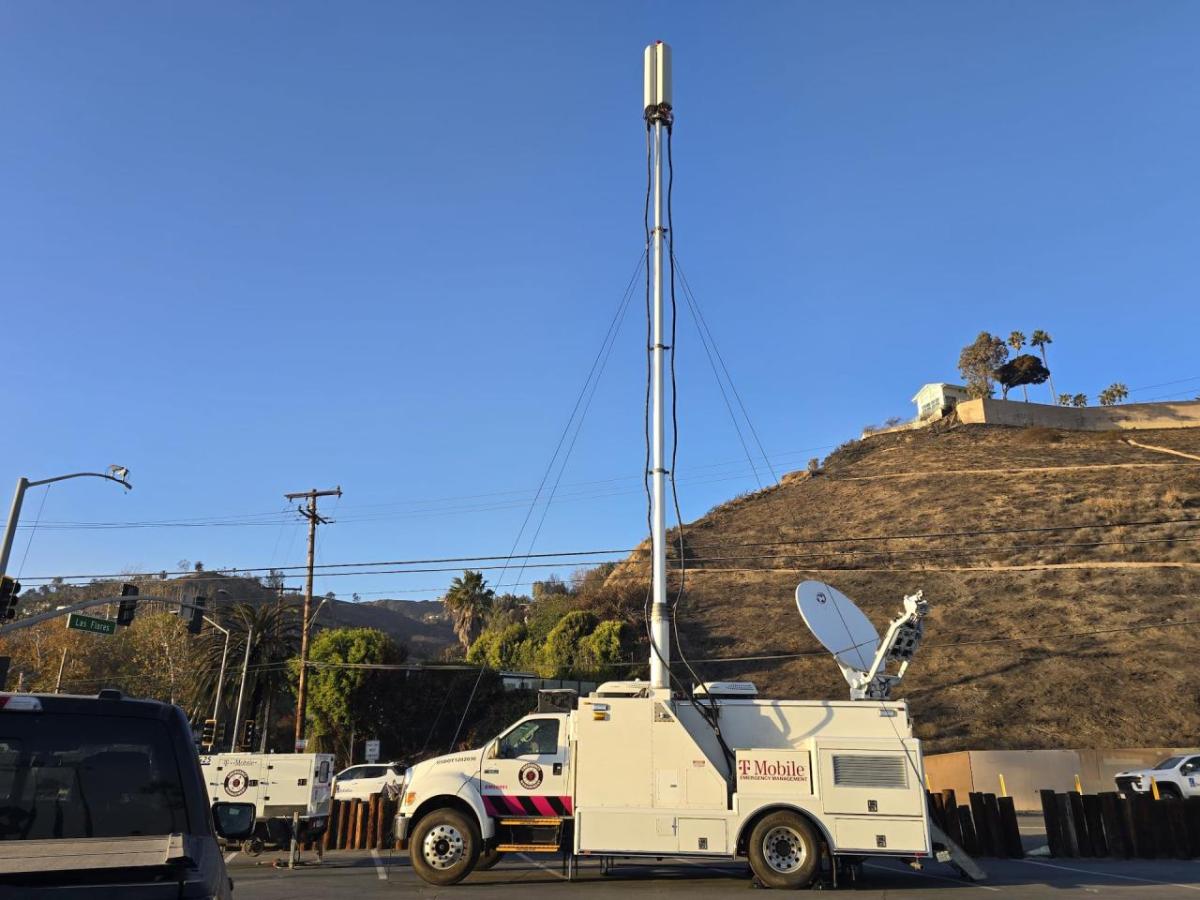 A T-Mobile vehicle below a structure on a hill