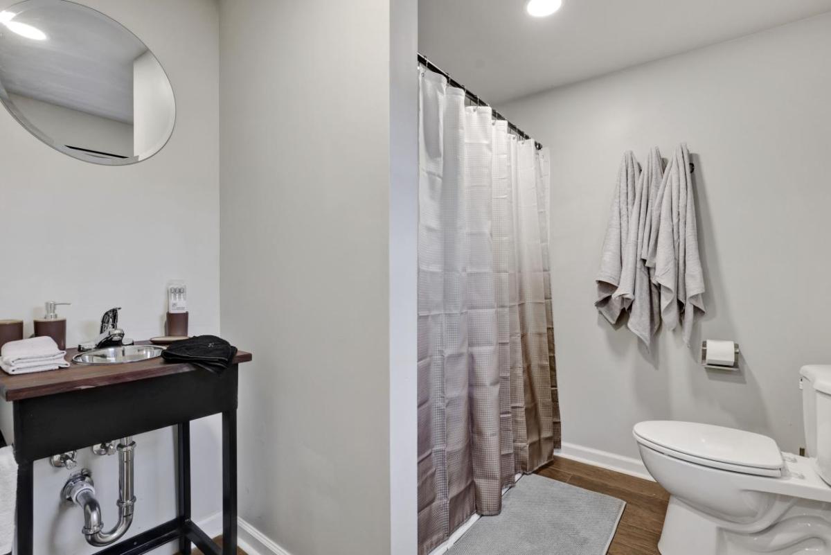 Bathroom with shower, sink and toilet