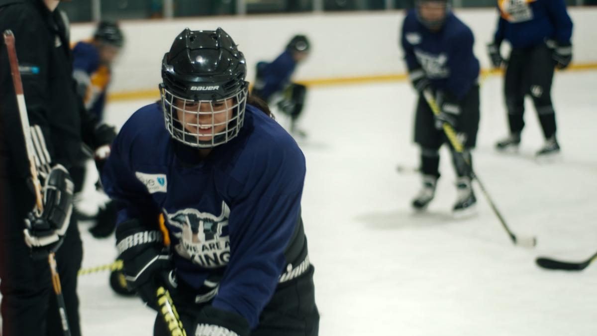 students playing hockey