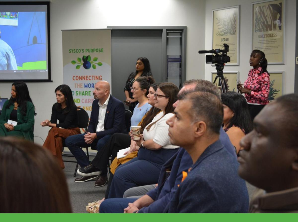 People seated and listening to a presentation