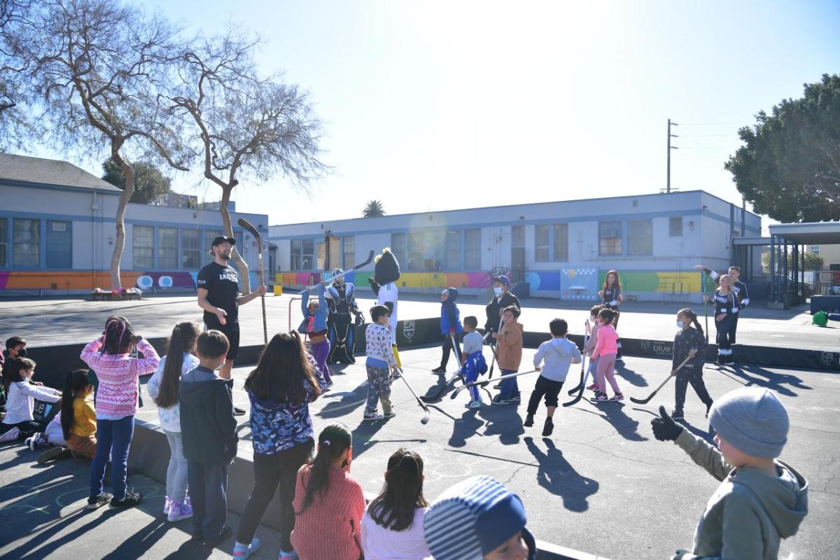 Students participate in the LA Kings ball hockey clinic at AEG's Service Day.