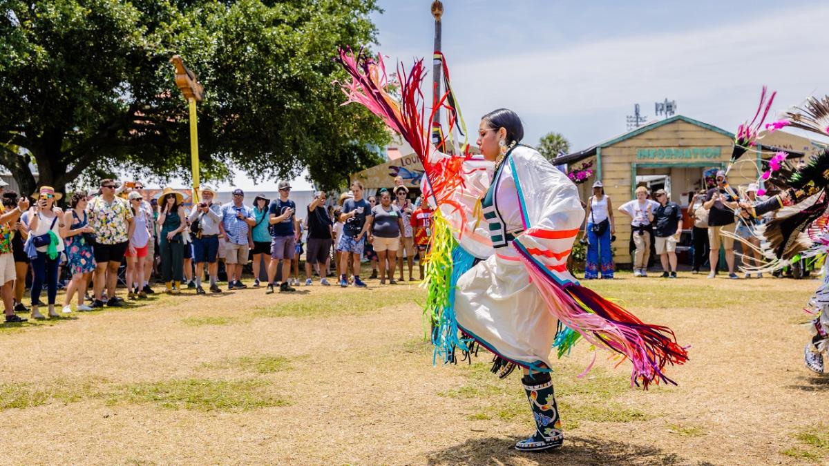 A person in traditional dress dancing.