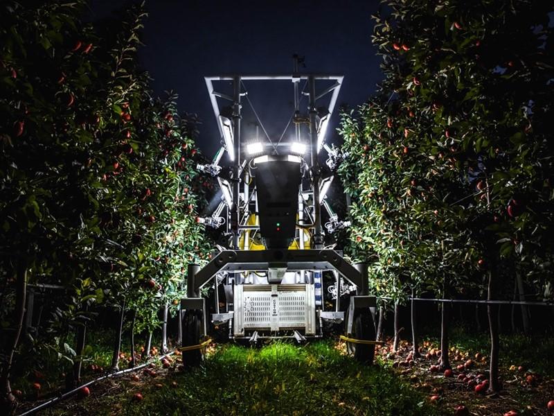 A piece of farm machinery with lights on