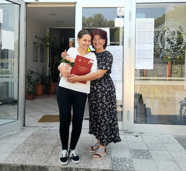 Aleksandra shown with her mom.