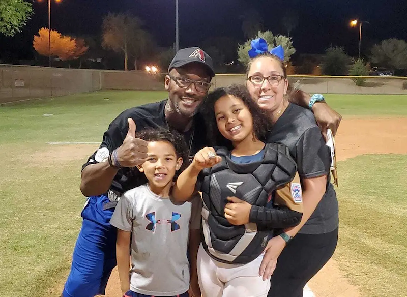 Andre and his family at a baseball game.
