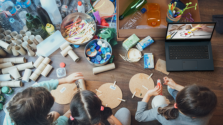 group doing arts and crafts with recyclables