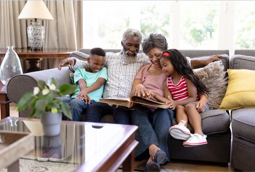 family of 4 sitting on couch