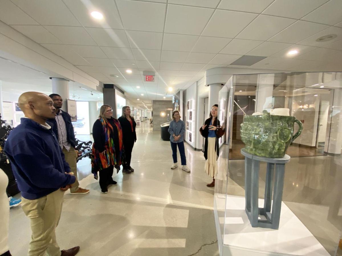 People looking at the sculpture in the gallery.