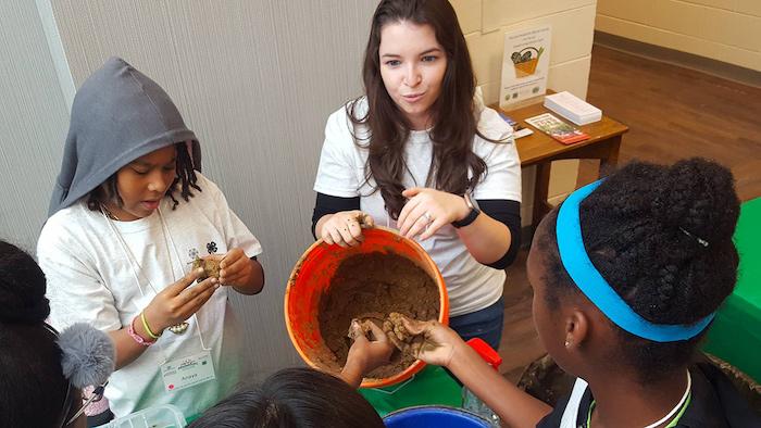  Bristol Myers Squibb‘s Kristen Petitjean led a soil study during this pre-COVID “Science Saturdays” program, in partnership with Mercer County 4-H. Led by volunteers from the company to stimulate STEM interests in young students through hands-on experiments, the program has been running for eight years, targeting greater Trenton, NJ, and surrounding areas.