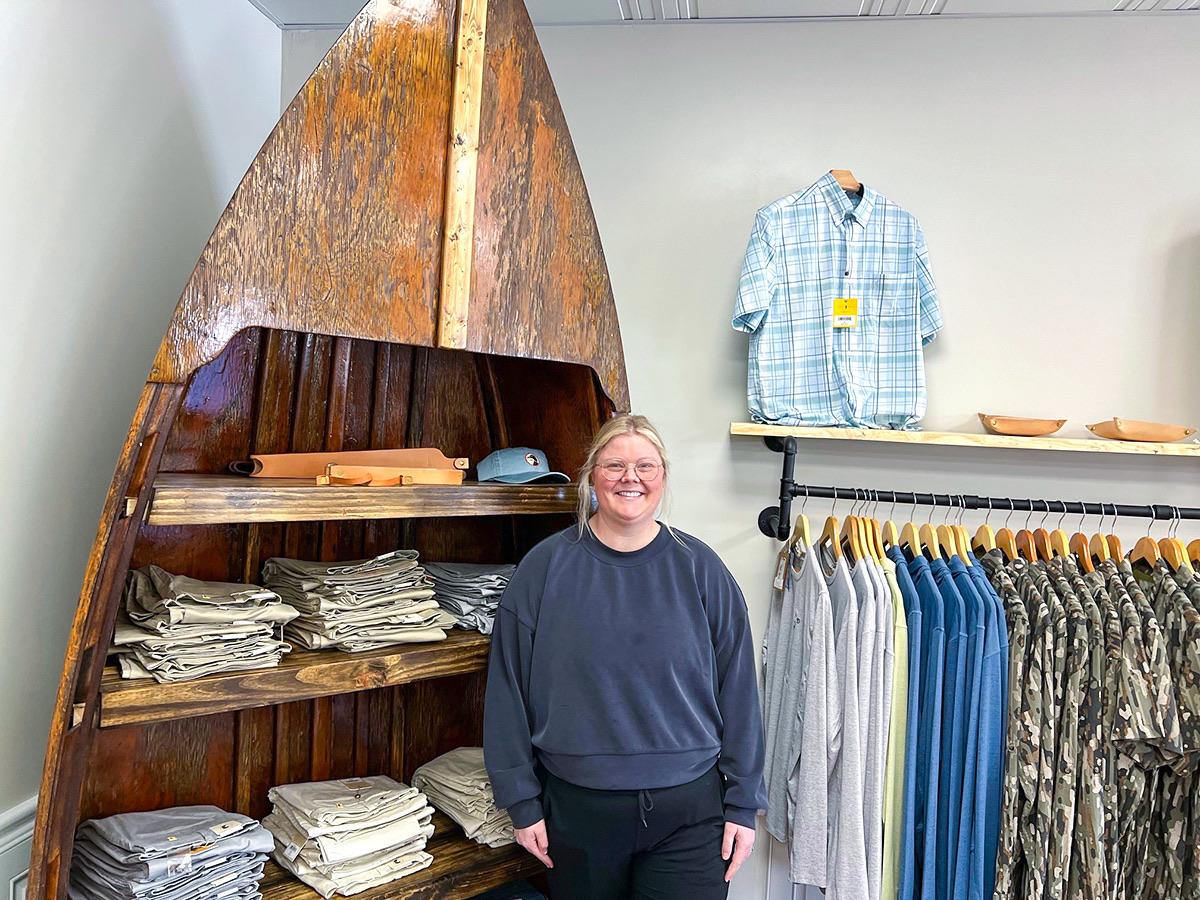 A person stood inside a clothes shop