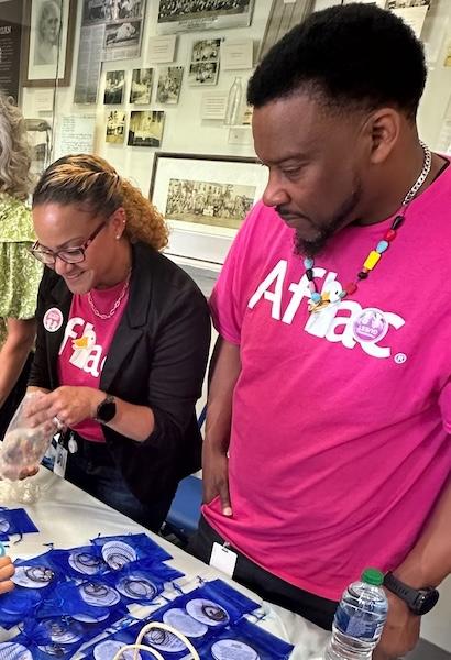 Aflac volunteers shown with the beads of courage.