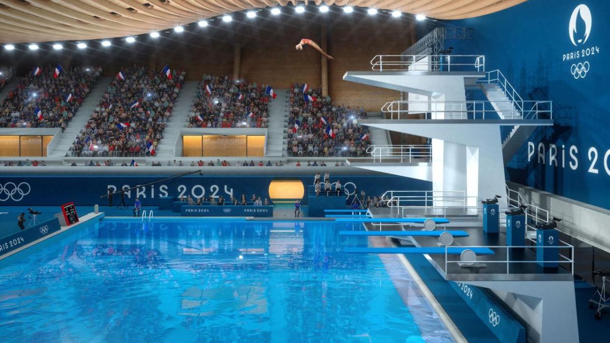 olympic athlete diving off a high platform into a pool