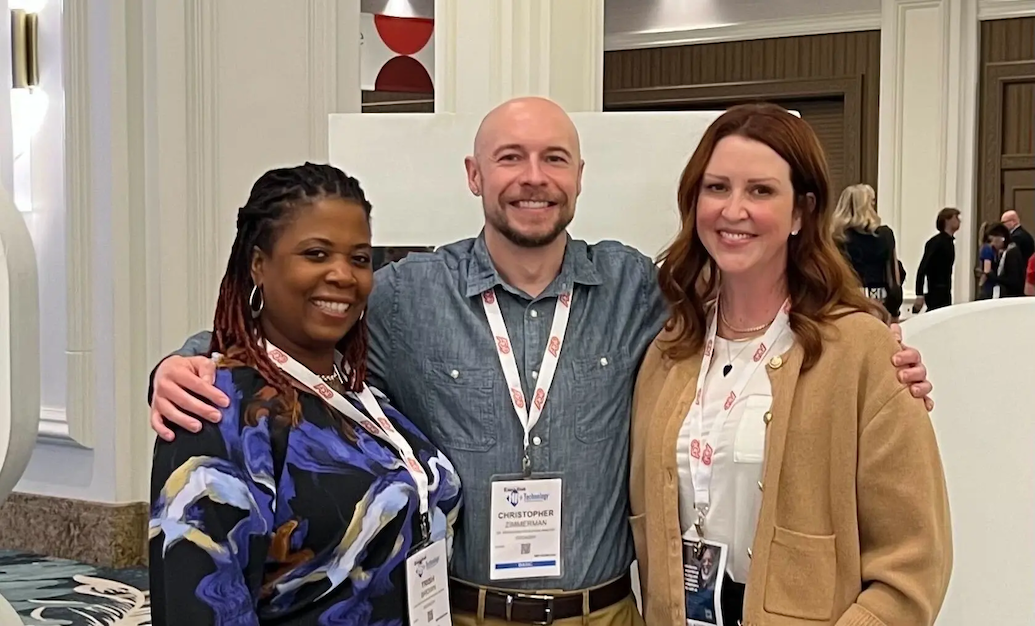 Christopher shown with two co-workers. 