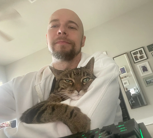 Christopher with his cat.