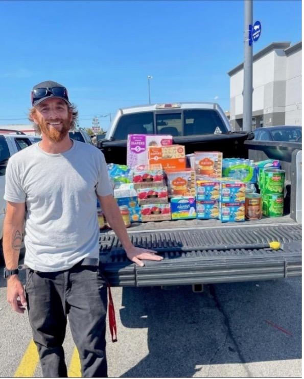 Mike Ash with a truck full of food to donate to shelters in Detroit.