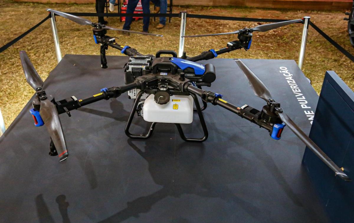 New Holland drone sprayer on a display stand