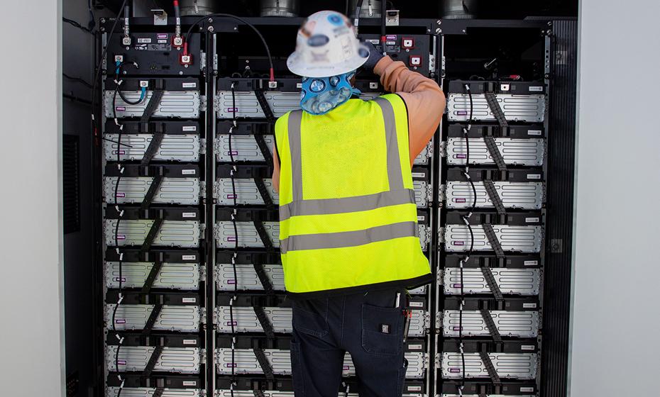 person working on electrical equipment