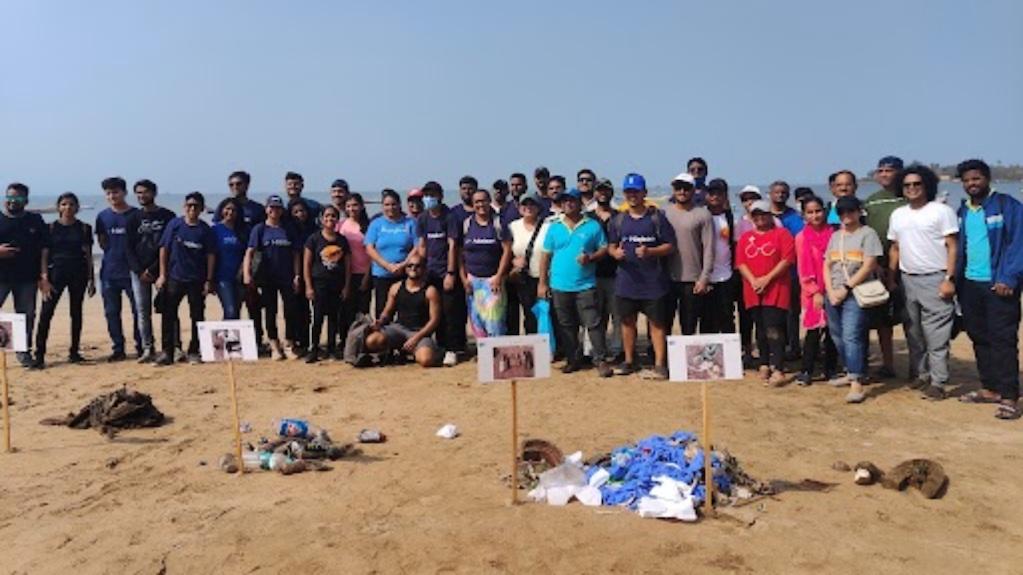 Nielsen volunteers cleaning a beach.