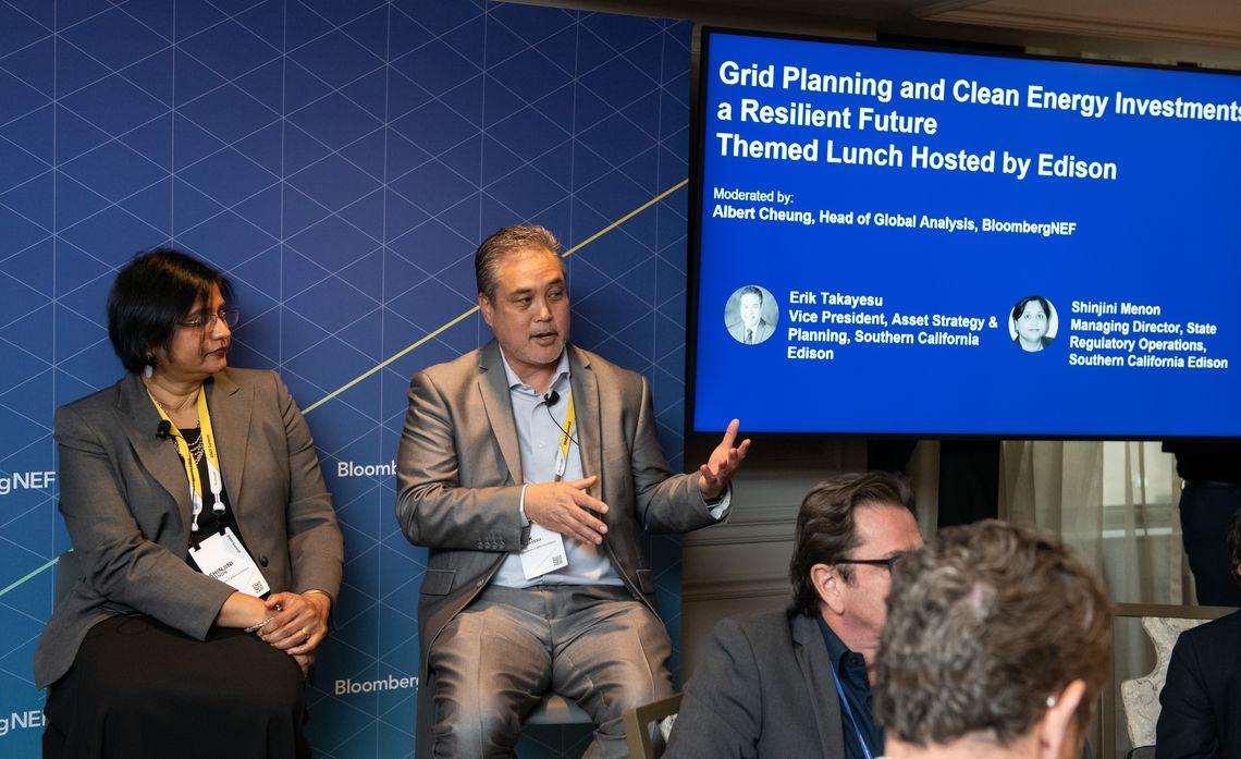 SCE executives Erik Takayesu (speaking) and Shinjini Menon explained the company's plans for transitioning to carbon-free energy sources at the BloombergNEF Summit in New York.