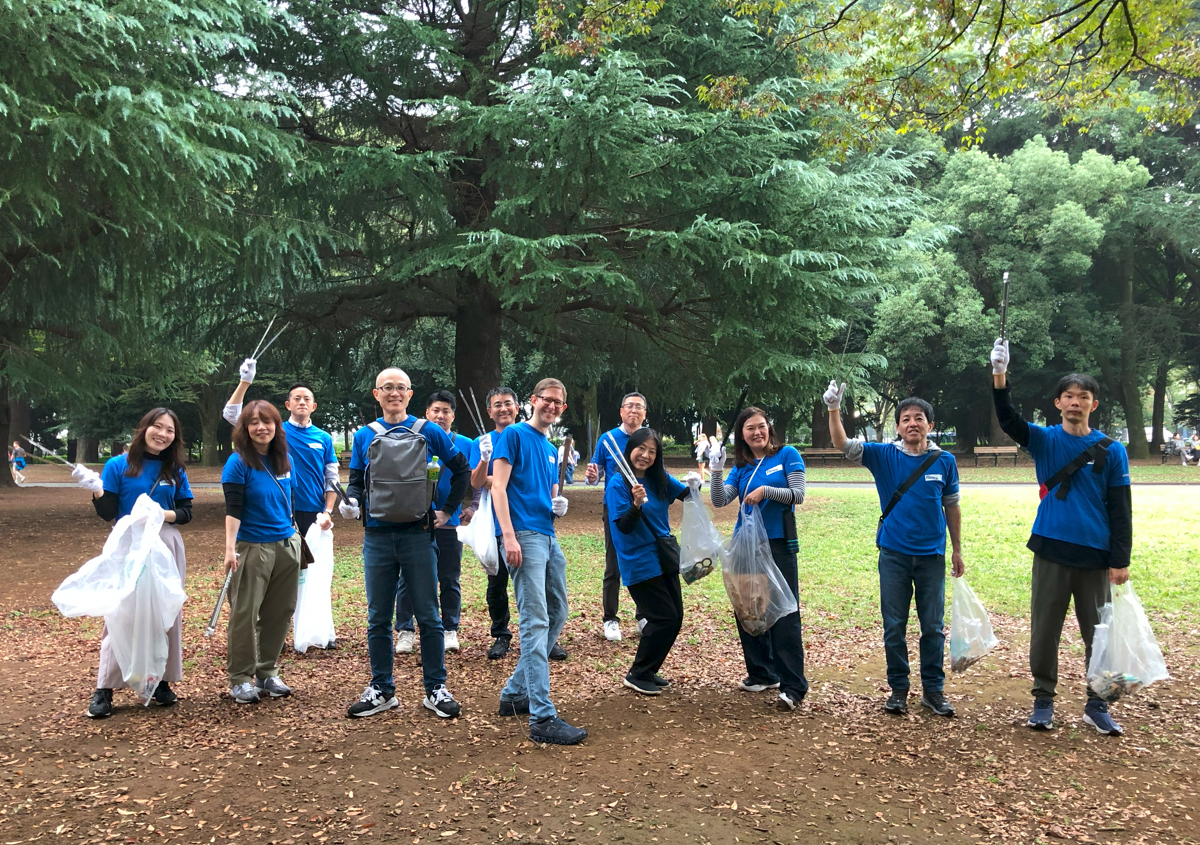 elanco employees holding trash bags