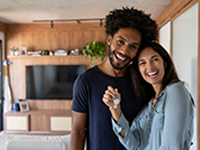 Smiling couple with keys