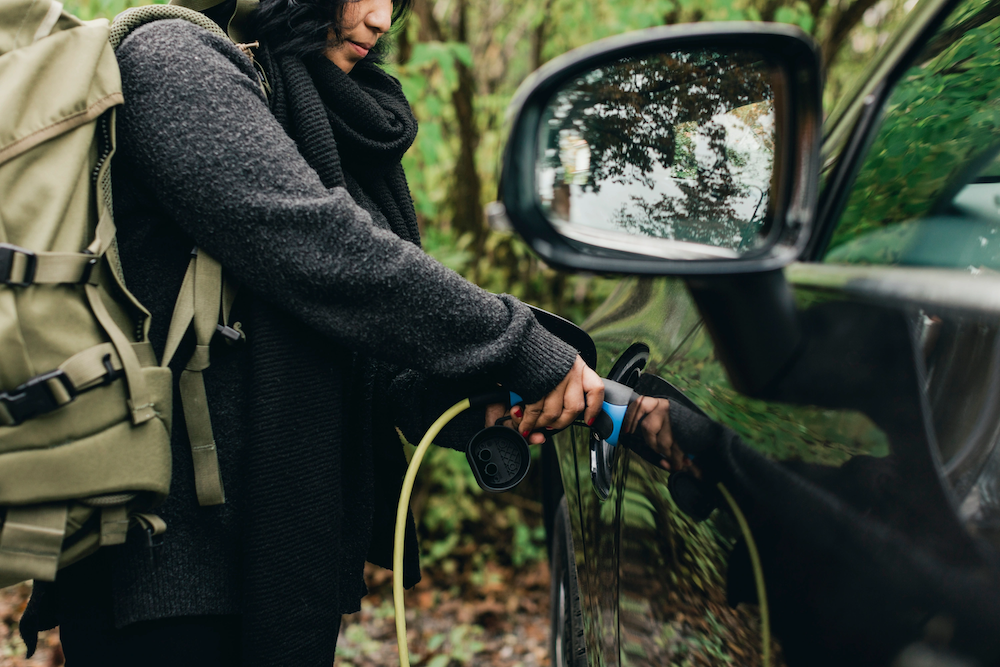 Person charging electric car