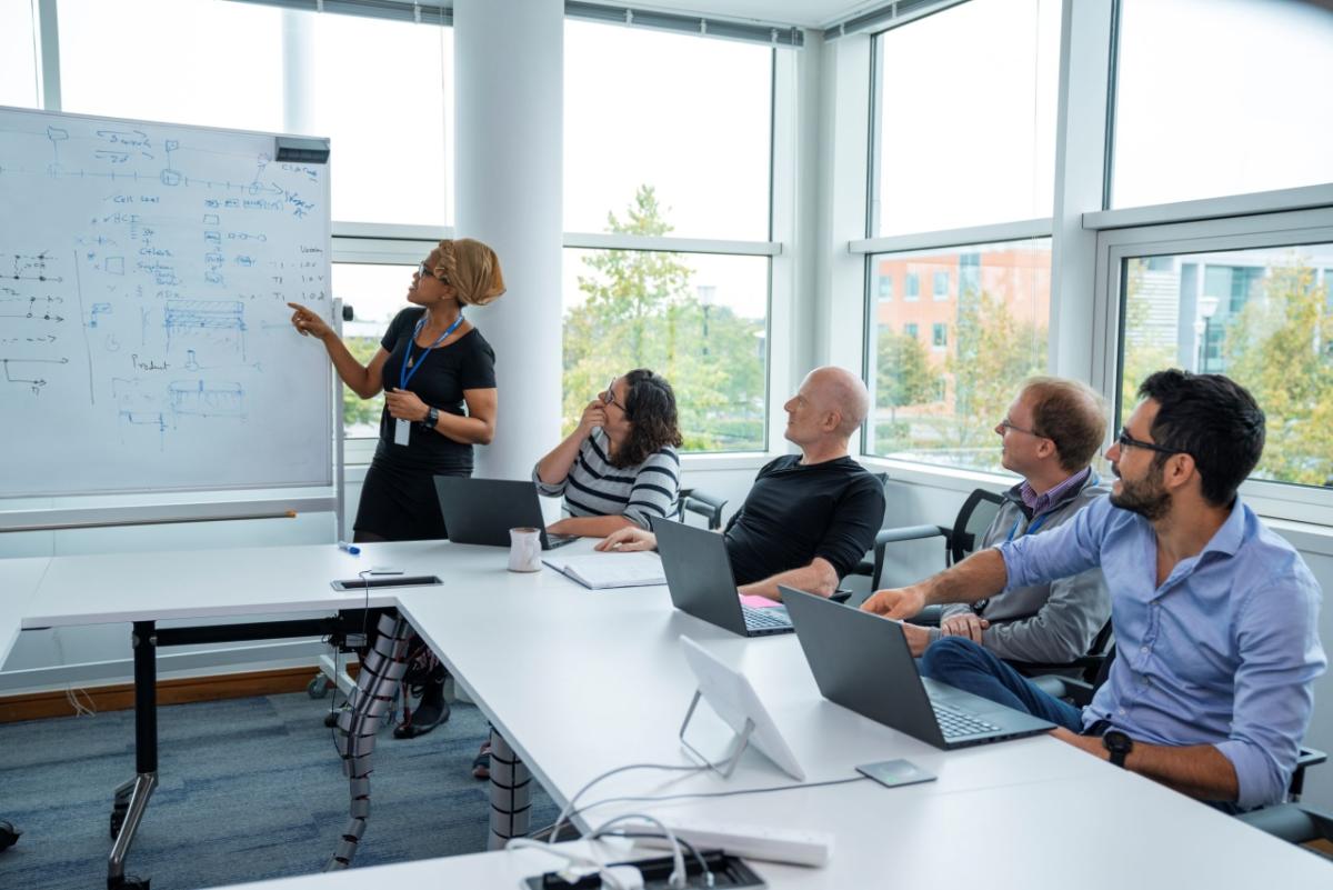 Qualcomm employees in a conference room