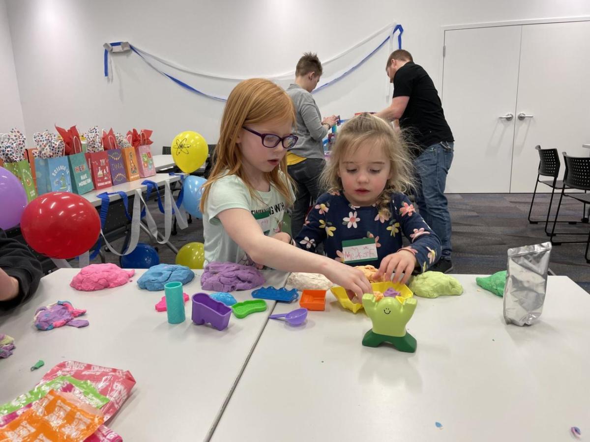 Two children participating in science experiments and activities