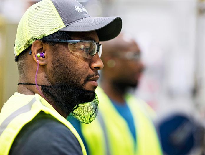 Male Essity employee wearing safety gear.