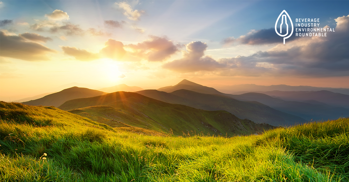 Sunrise over hills with BIER logo in top right corner