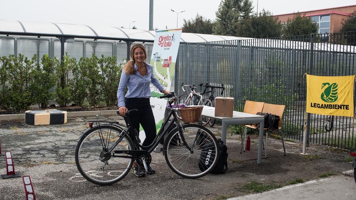 person posing with a bicycle