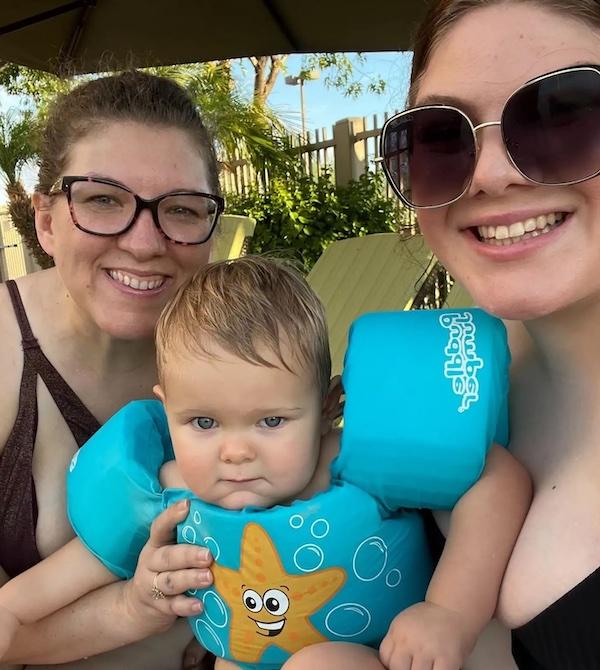 Sarah Smith at the pool with a young child.