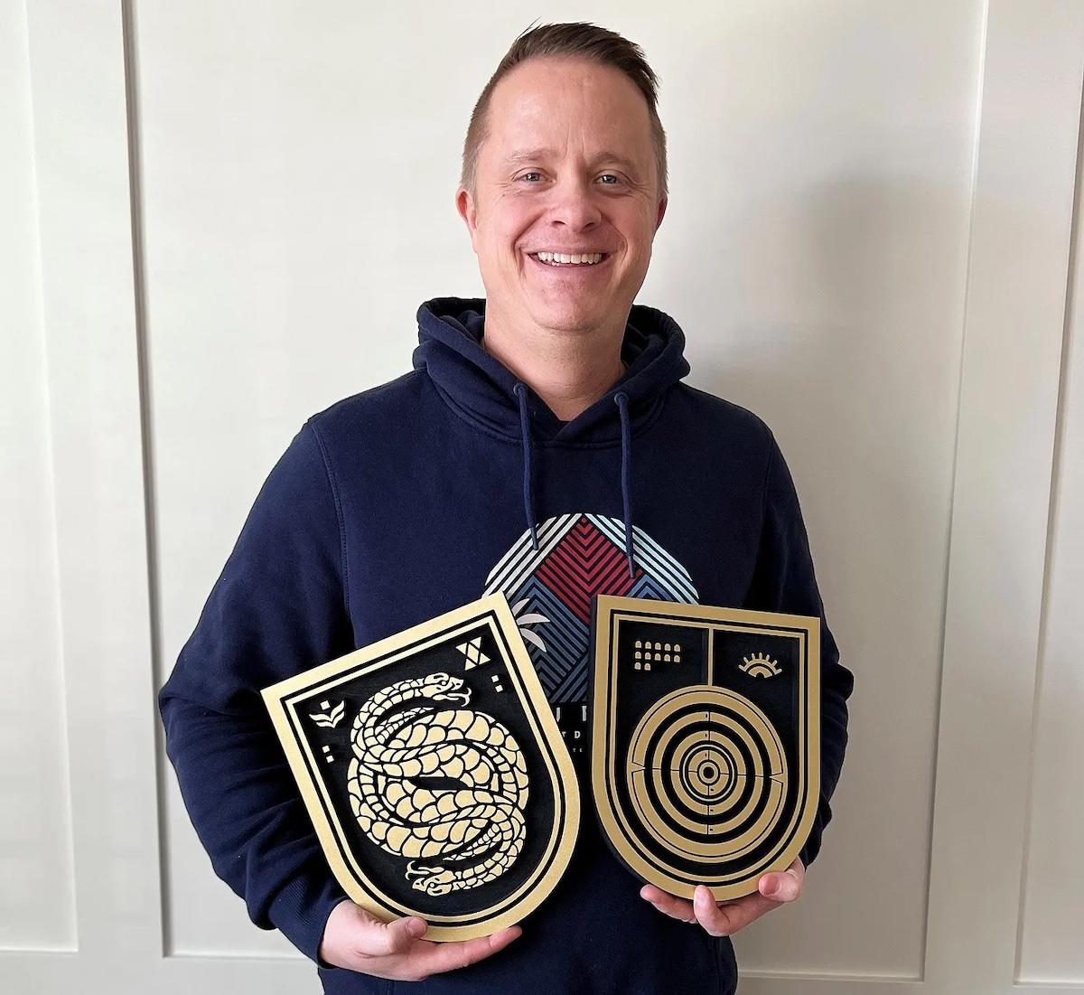 Lee Glasgow holding two of his creations.