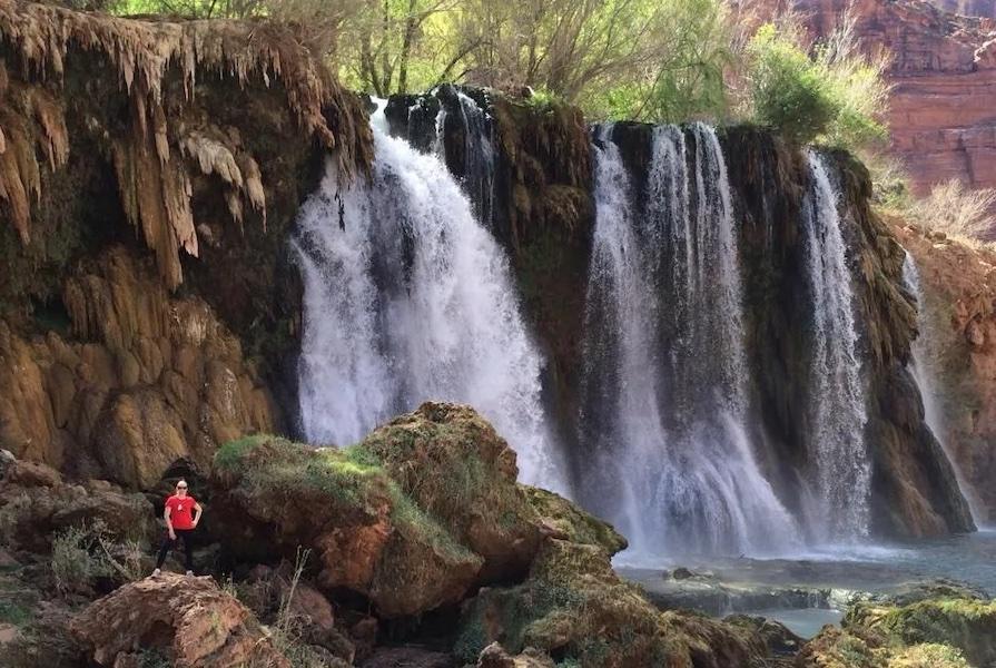 Christie in front of a waterfall.