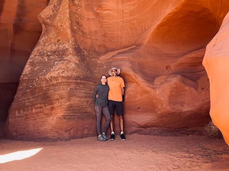 Christie and her husband inside a cave.