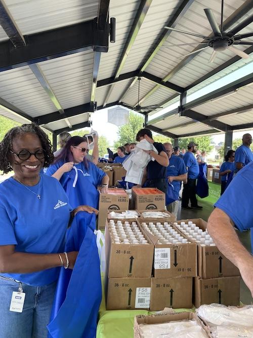 Saint-Gobain volunteers shown at Good 360 event.