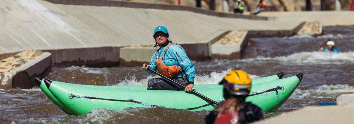 person kayaking in the river 