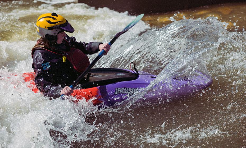 Person kayaking in the river