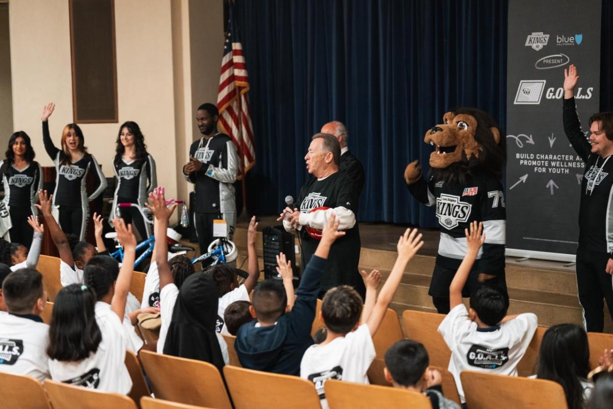 To support the bike giveaway, the LA Kings Ice Crew and staff volunteers assembled the bikes and alumni Daryl Evans, and mascot Bailey hosted a school assembly.