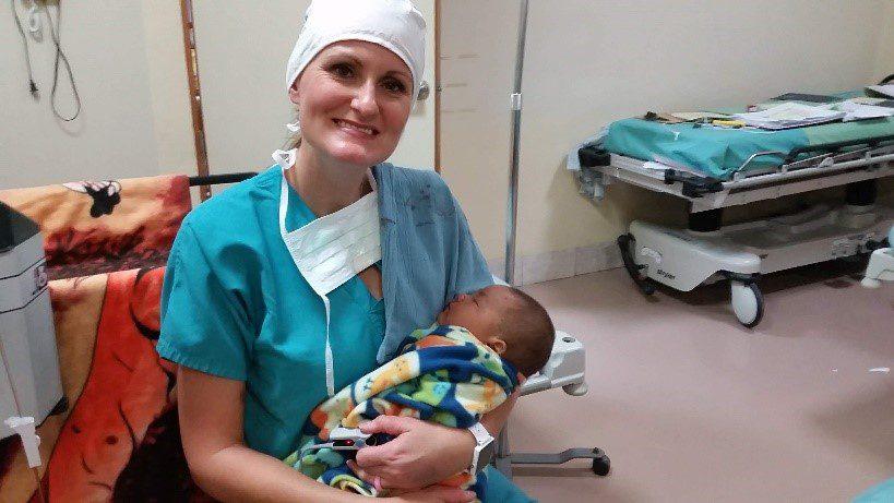 Doctor holding a baby