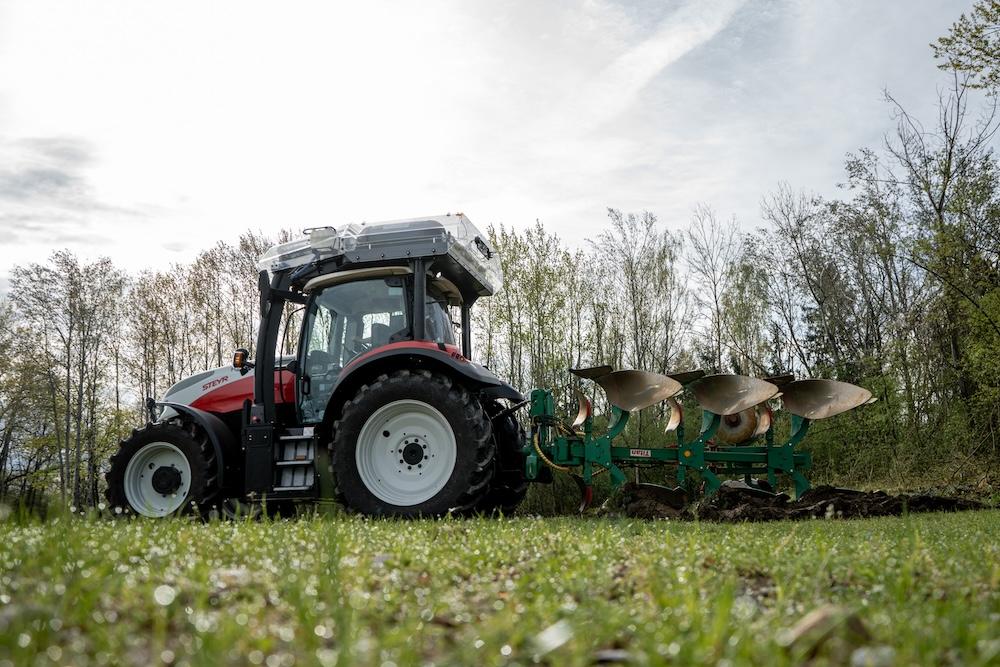 red tractor working in field